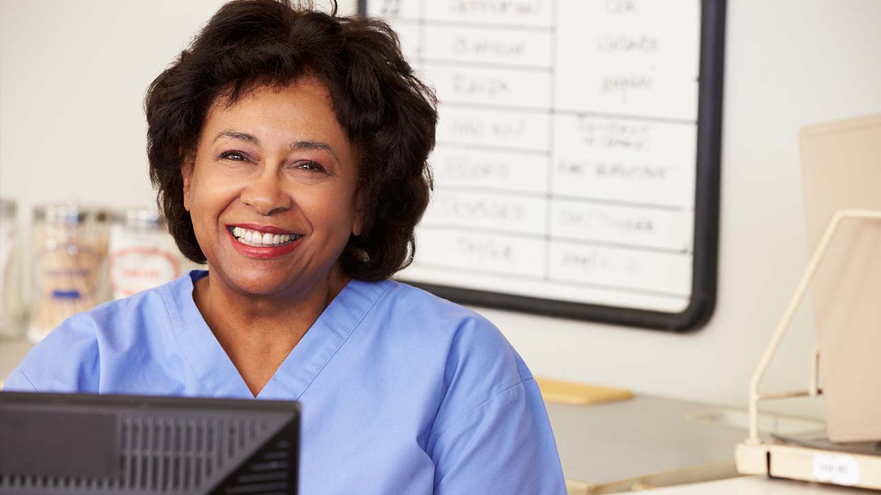 nurse at the reception area waiting to talk to patients about medical weight loss schedules